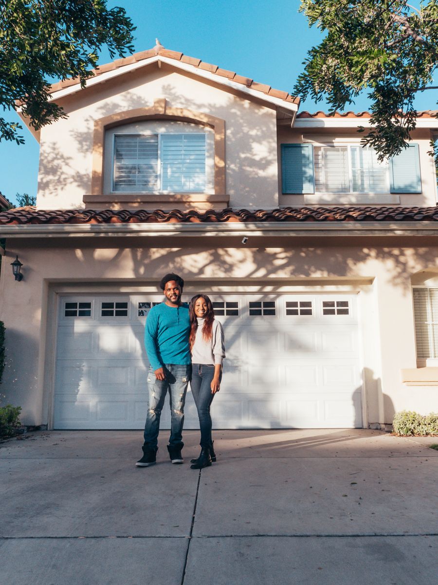 A homeowner welcoming a home services professional at the door