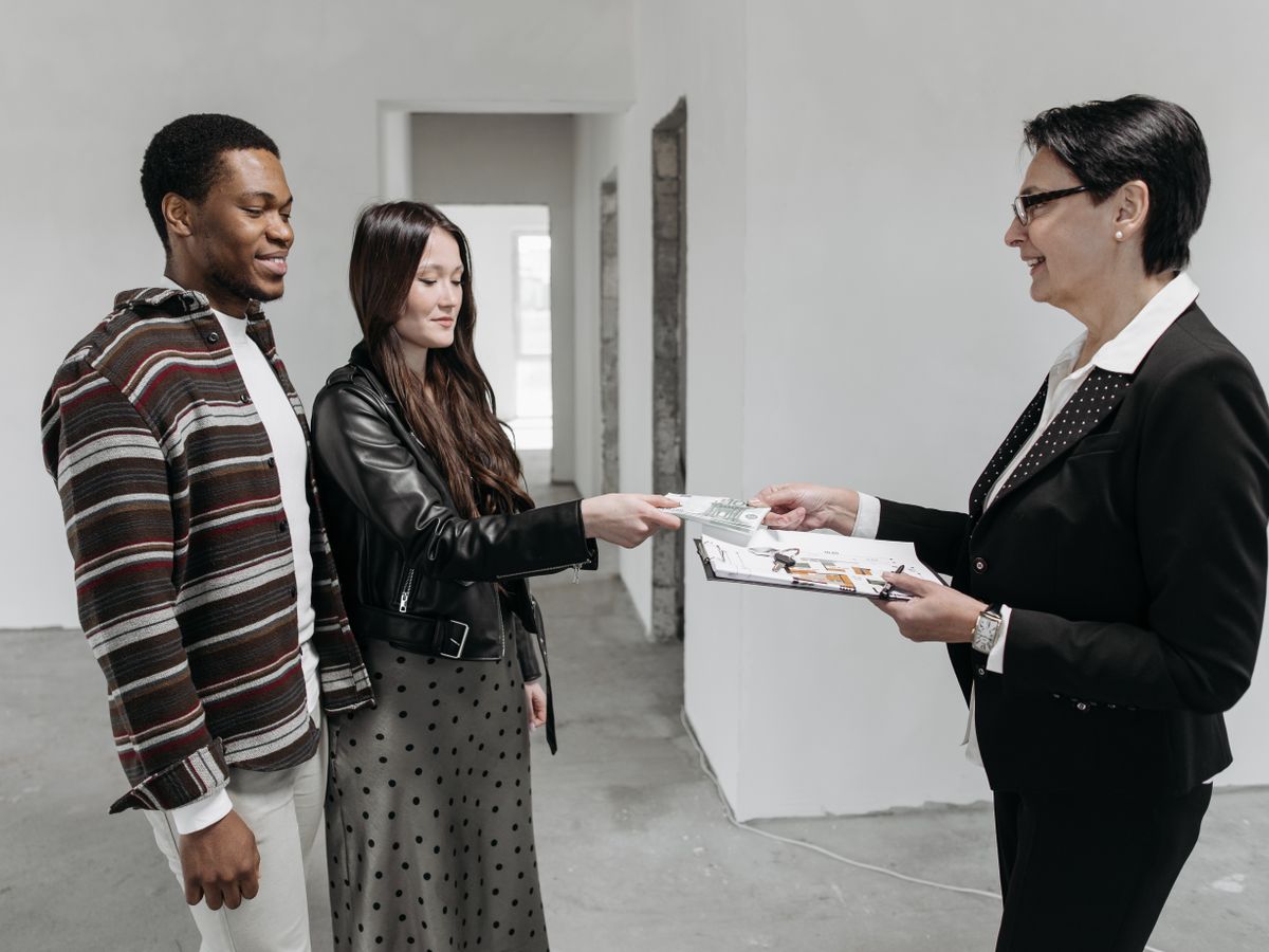 A couple touring a home with an agent